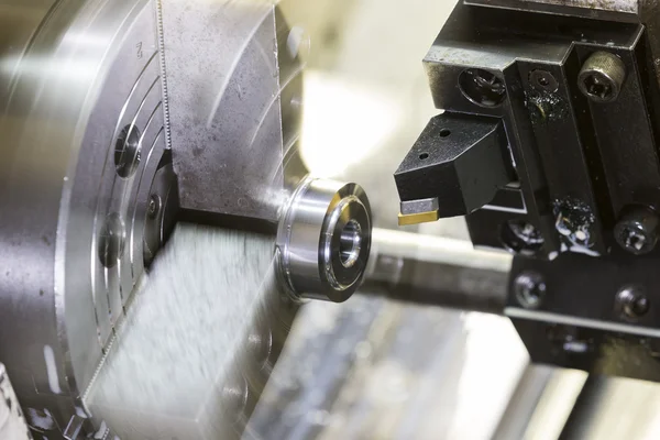 Turning automotive part by cnc lathe — Stock fotografie