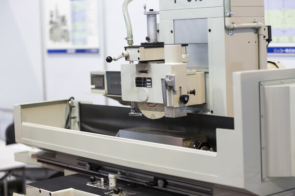 operator grinding surface of mold and die parts