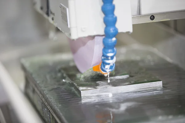 Operator grinding surface of mold and die parts — Stock Photo, Image