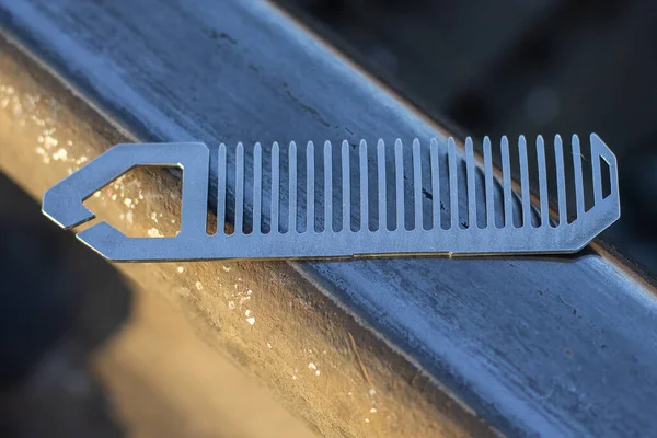 Handmade metal comb for beard.