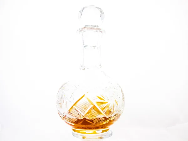 Un decanter di brandy su fondo bianco — Foto Stock
