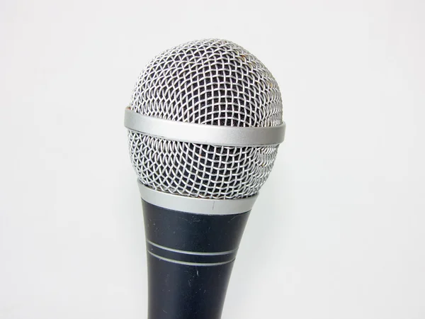 Ett fragment av en mikrofon på vit bakgrund — Stockfoto