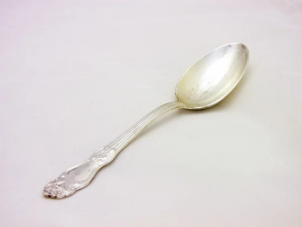 Silver tablespoon over a white background — Stock Photo, Image