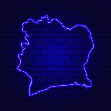 Fildişi Sahili, tuğla duvar zemininde parlayan neon tabela