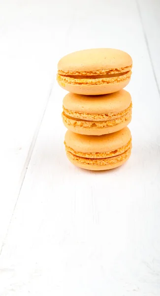 Set of macarons on white wooden table — Stock Photo, Image