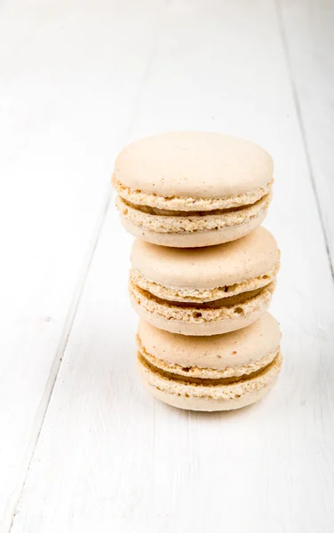 Set of macarons on white wooden table — Stock Photo, Image