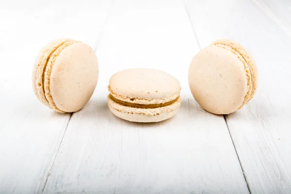 Set of macarons on white wooden table — Stock Photo, Image