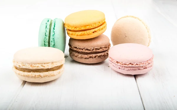 Set of macarons on white wooden table — Stock Photo, Image