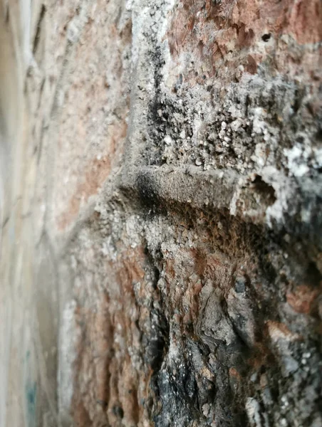 Old stone wall stone tunnel texture, background, blurred background, selective focus