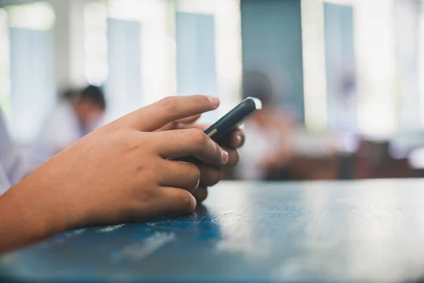 Students doing educational exam test by smartphone with stress