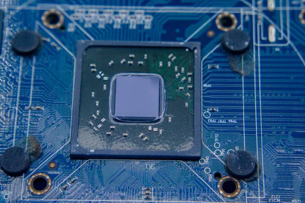 Graphic card Processors. Macro view of a Futuristic Electronic Circuit Board with Microchips and Processors. Technology Background concept. Selective focus