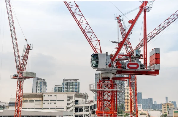 View of the construction site and red cranes for build modern  residential area, construction concept for the develop city.