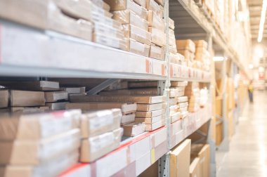 Warehouse with cardboard boxes inside on pallets racks prepare for customer for choose and shopping the furniture that self service at the furniture warehouse store.
