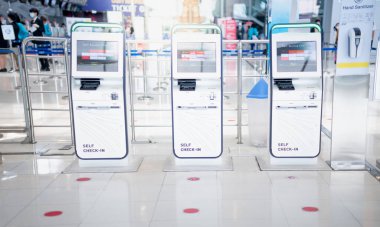 BANGKOK THAILAND APR 14 2021  Many auto check-in self service for traveler prepare for travel or working at the airport. Due to the Covid-19 epidemic pandemic. clipart