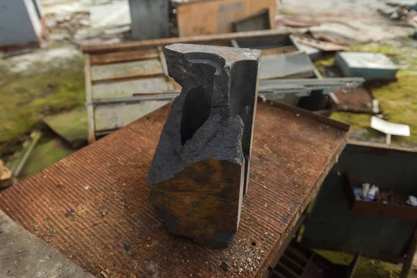 Piece of graphite from Chernobyl nuclear reactor in abandoned plant Jupiter near ghost town Pripyat, Ukraine