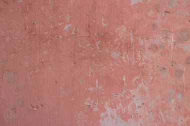Kırık boya dokusuna sahip açık kırmızı beton duvar, eski hasarlı yüzey, soyut renk duvar kağıdı, Çernobil 'de radyoaktif atık