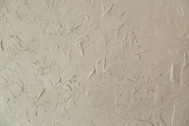 Duvar, beton ve alçı için dekoratif alçıyla süslenmiş. Renkli ışık.