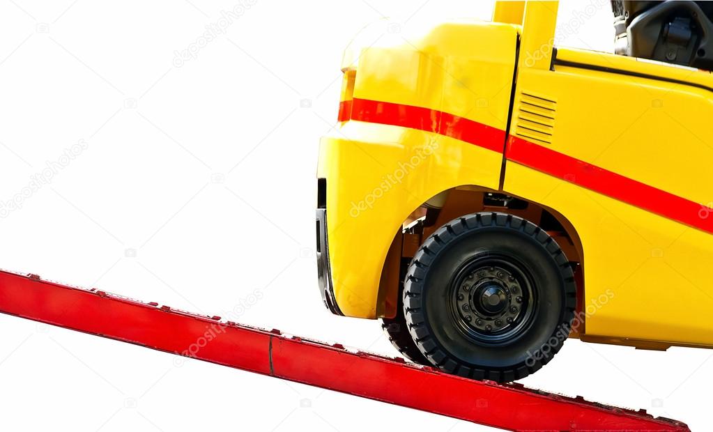 Forklift  on loading dock close up  isolated on white background