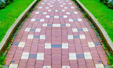 walkway brick in the garden with green grass clipart
