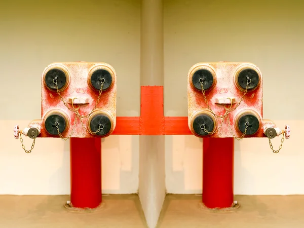 Red fire hydrant  on wall — Stock Photo, Image