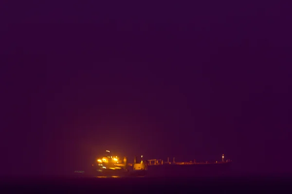 Alone boat,Sea cargo ship at night — Stock Photo, Image