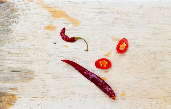 Fresh and dried chili on plastic slabs. — Stock Photo, Image