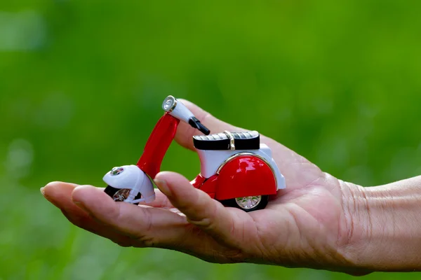 Mini motorcycle in hand — Stock Photo, Image