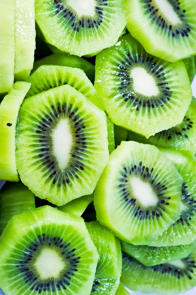 Close up de belas fatias de frutas kiwi fundo — Fotografia de Stock