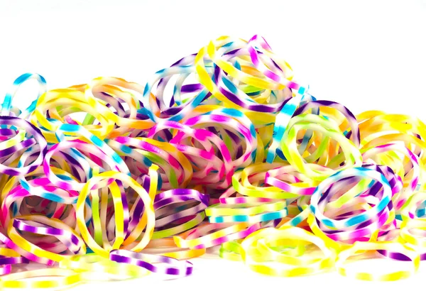 Close up of colorful elastic loom bands rainbow color full on wh — Stock Photo, Image