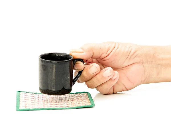 Old Man hand hold with black cup on the white table — Stock Photo, Image