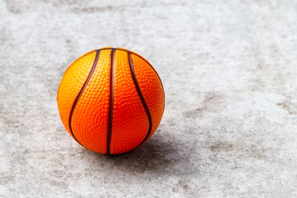 Ball on concrete floor — Stock Photo, Image