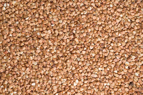 Delicious food background of brown buckwheat — Stock Photo, Image