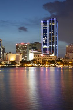 HO CHI MINH CITY, VIETNAM - JULY 21, 2015 : Saigon riverside night view at downtown center with buildings across riverside Saigon river Ho Chi Minh City