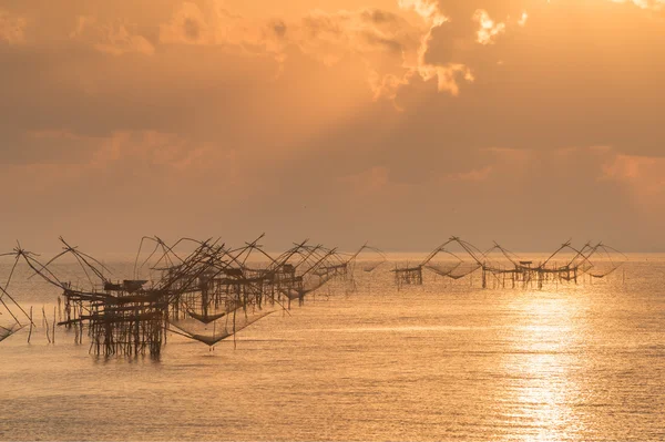 Silhouette of fish lift nets at sunrise — Stock Photo, Image