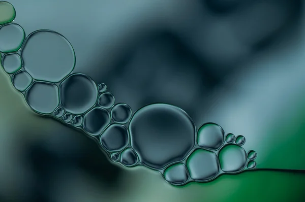 Gotas de aceite y burbujas de aire en el agua —  Fotos de Stock