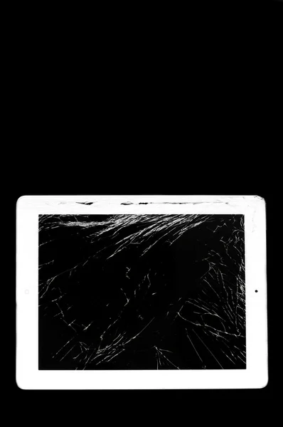 Tablet computer with broken glass screen — Stock Photo, Image