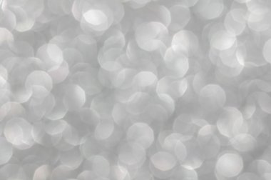 Odaklanamayan soyut gümüş ışıklar arka planı