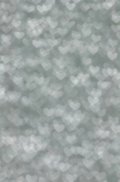 Desenfocado abstracto gris corazones fondo claro — Foto de Stock