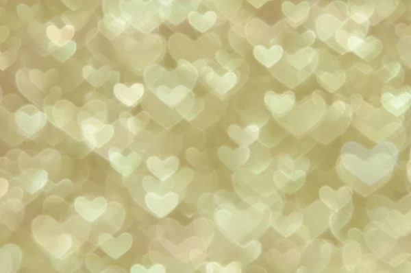 Defocused abstract golden hearts light background — Stock Photo, Image