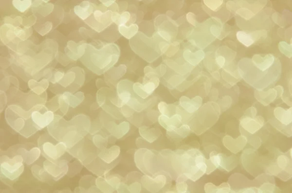 Размягченные абстрактные золотые сердца светлый фон — стоковое фото