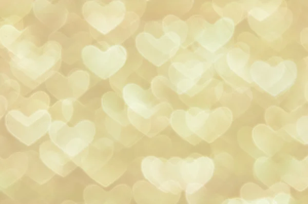 Defocused abstrakt gyllene hjärtan ljus bakgrund — Stockfoto
