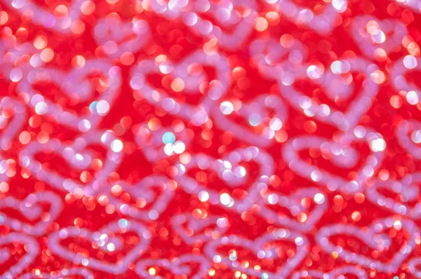 Luces rojas abstractas desenfocadas con fondo de corazón — Foto de Stock