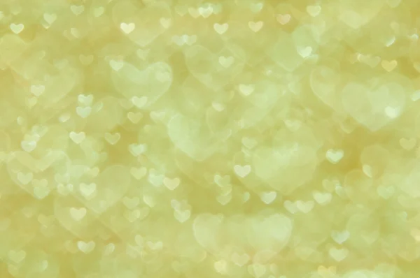 Desenfocado abstracto corazones dorados luz fondo — Foto de Stock