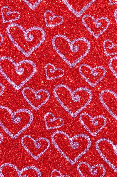 Paillettes rouges avec fond de texture de coeur — Photo