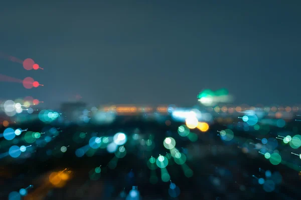 Ciudad abstracta desenfocada luces de noche fondo — Foto de Stock