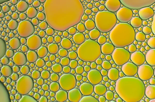 Gotas de aceite y burbujas de aire en el agua — Foto de Stock