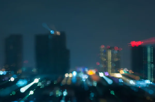 Ciudad abstracta desenfocada luces de noche fondo — Foto de Stock