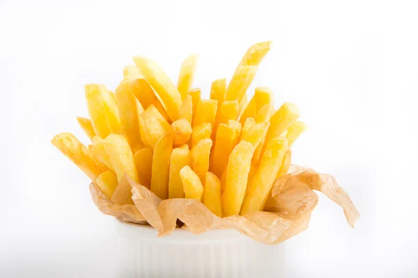 Papas fritas en una envoltura de papel — Foto de Stock