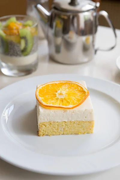 Orange sponge cake with orange slice on top