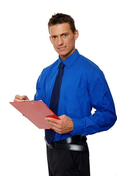 Man in blue shirt writes document — Stock Photo, Image